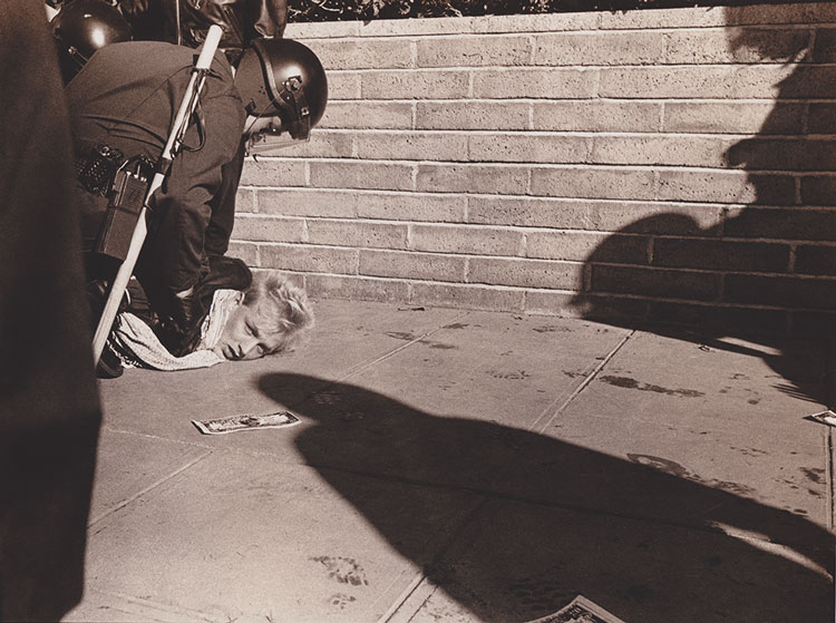 Phyllis Christopher. ACT-UP Protest at Burroughs Welcome Pharmaceutical Company, Livermore, CA, 1989. Silver gelatin print. © Phyllis Christopher.