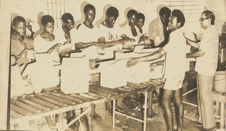 John in the Packaging Department of the Factory, Freetown, Sierra Leone | The Archive Project, Courtesy - Saviya Lopes.