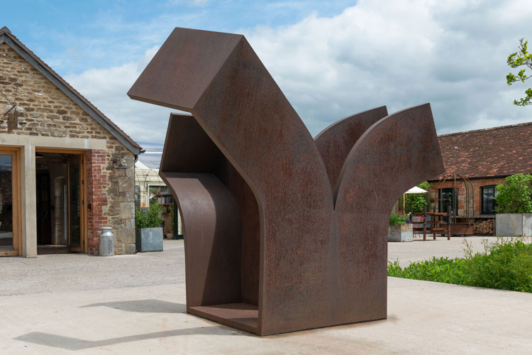 Eduardo Chillida, Consejo al Espacio IX (Advice to Space IX), 2000. Corten steel, 200 x 185 x 240 cm (78 ¾ x 72 7/8 x 94 ½ in). Installation view, Eduardo Chillida, Hauser & Wirth Somerset, 2021. Courtesy the Estate of Eduardo Chillida and Hauser & Wirth. Photo: Ken Adlard. © Zabalaga Leku. San Sebastián, VEGAP (2021).