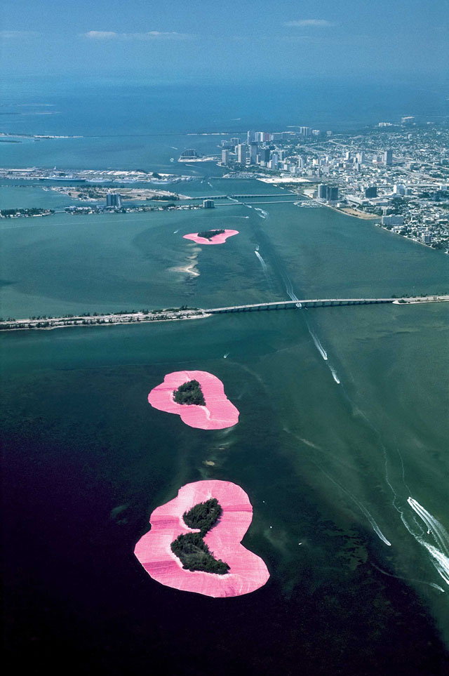 Christo and Jeanne-Claude. Documentary photograph of Surrounded Islands, Biscayne Bay, Greater Miami, Florida, 1980–83. Woven polypropylene fabric surrounding 11 islands, Styrofoam, steel cables, and anchoring system, 6.5 million sq ft of fabric overall. Photo: Wolfgang Volz © Christo 1983.
