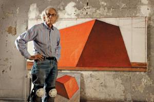 Christo in his studio with a preparatory drawing for The Mastaba, 2012. Photo: Wolfgang Volz. © 2012 Christo.