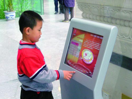 A visitor using the very popular multimedia facility inside the museum. Courtesy of the Capital Museum, Beijing.