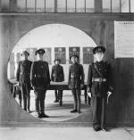 Cecil Beaton. China, 1944: The Chinese Police Force: the Assistant Chief of Police and his staff grouped in a circular doorway at headquarters in Chengtu. Part of Imperial War Museum’s ‘Ministry of Information Second World War Official Collection’.