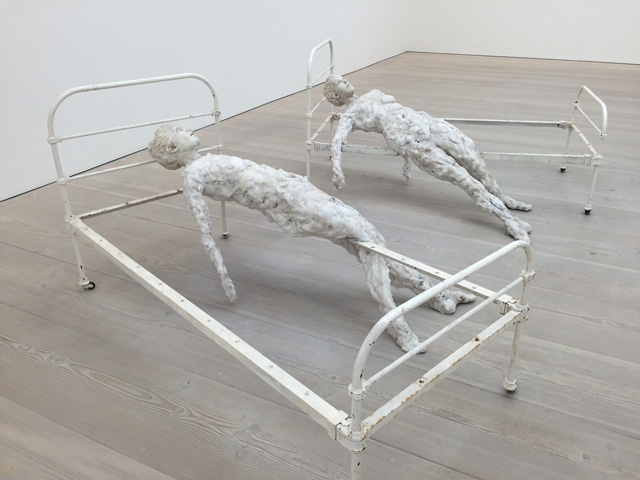 Virgile Ittah. Echoué au seuil de la raison, 2014. Mixed wax, marble dust, pair of unique cast iron beds, dimensions variable. Photograph: Martin Kennedy.