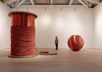 Alice Anderson. Left: Bound, 2011. Bobbin made of wood and copper thread, 345 x 248 x 248 cm. Right: 181 Kilometers, 2015. Sculpture made after performances, copper thread 200 cm (diameter). Photograph © Steve White, 2015. Courtesy of the Saatchi Gallery, London.