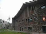 An interplay of concrete structures with in-fill ‘roof tile’ wall.