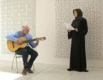 Jorge Benitez and Susan Schuld in front of Gower's Papercuts. Performance image: Jam Jar Gallery, Dubai, 15 September 2014. Photograph: Reni Gower.