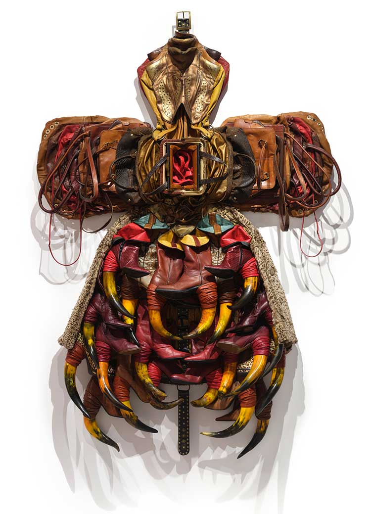 Anindita Dutta, Hall of Opened Purses, 2024, leather belt, bag, boot, fur coat, dyed animal horns and dyed flowers, 79 × 58 × 8 1/2 in.