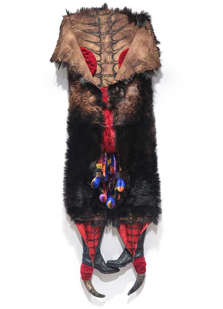 Anindita Dutta, Orchard within the hide, 2025, animal hide, horn, shoe, velvet cloth, 83 × 32 × 12 in.