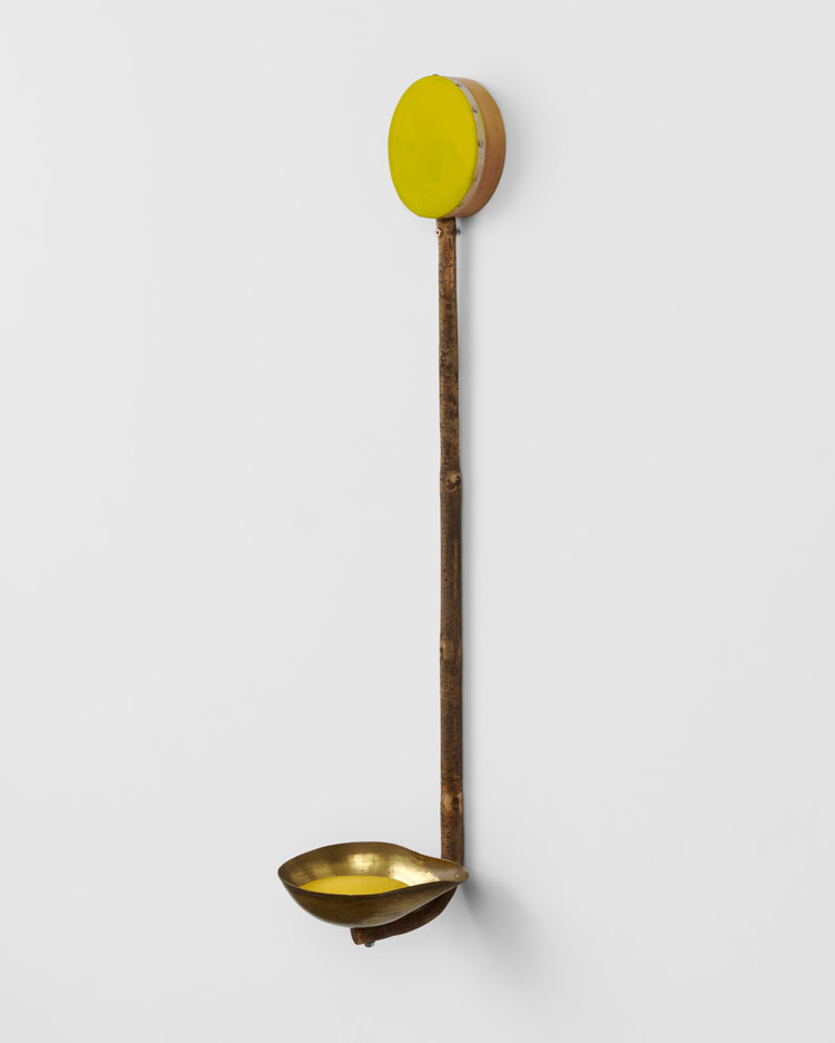 Alexandre da Cunha. Ikebana (relief III), 2020. Hand drum, walking stick, brass scoop, coloured sand, 100 x 20.7 x 21.6 cm (39 3/8 x 8 1/8 x 8 1/2 in). © Alexandre da Cunha. Courtesy the artist and Thomas Dane Gallery. Photo: Ben Westoby.