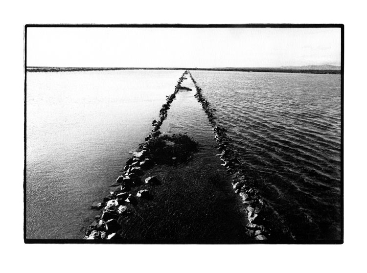 Toby Deveson, Gruissan, France, March 2017. Silver Gelatin print. Taken with a Nikkormat using a 24mm lens and Kodak T-Max 400 film. Printed on Foma 532 fibre-based paper.