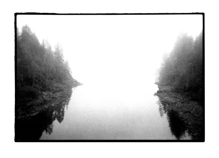 Toby Deveson, Juuma, Finland, August 2003. Silver Gelatin print. Taken with a Nikkormat using a 24mm lens and Kodak T-Max 400 film. Printed on Foma 532 fibre-based paper.