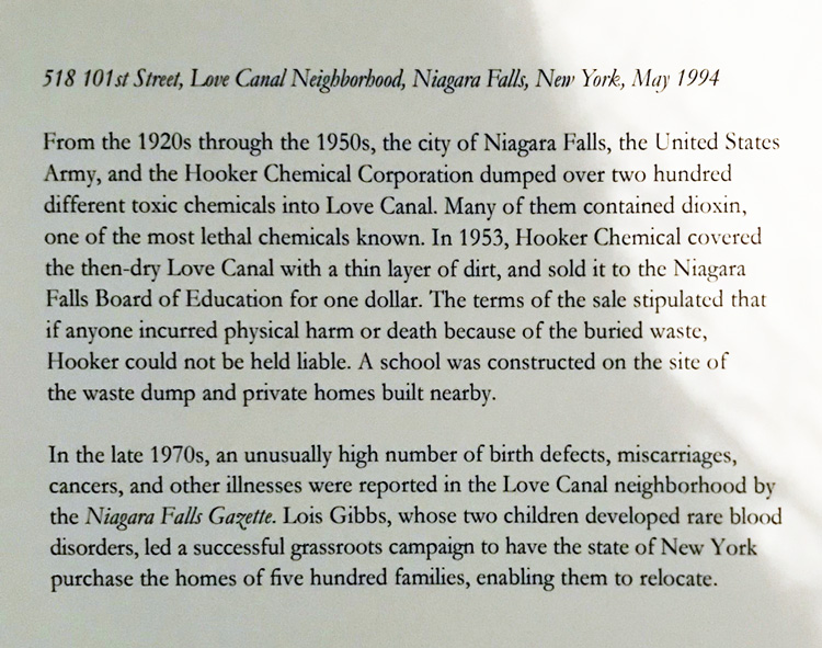 Joel Sternfeld. 518 101st Street, Love Canal Neighborhood, Niagara Falls, New York, May 1994, accompanying text. Photograph. Installation view photo: Christiana Spens.