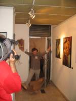Dadadventure, September 9: Opening of the exhibition with ‘Tristan Tzara’ breaking through the brown paper door in the exhibition © Romanian Cultural Institute New York.