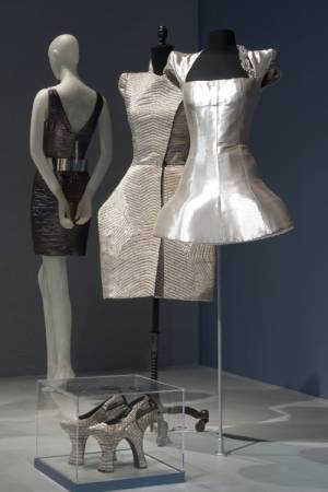 Dresses and shoes from the ARMOR section of the exhibition <em>Daphne Guinness</em> at The Museum at FIT. Photograph courtesy The Museum at FIT.
