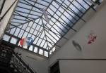 Chelsea Hotel. View of skylight and main staircase from 10th floor. Hanging artwork is an installation by Arthur Weinsten. Photograph: Miguel Benavides. © Studio International.