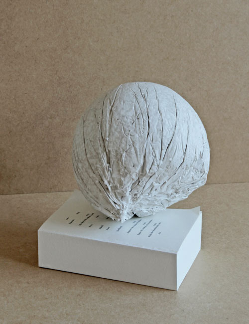 Michael Dean. Analogue series (head), 2012. Concrete. Untitled, 2012 supports the structure of the face. Replenished perfect bound book, diminishing page count. Courtesy of the artist, Herald St, London and Supportico Lopez, Berlin.