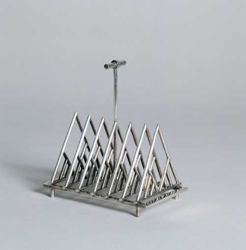 Toast rack designed by Christopher Dresser. Manufactured by James Dixon 
        & Sons Sheffield, England, ca. 1879 Silver-plated metal (electroplate). 
        From the Collection of Ellen and Bill Taubman. Photo: © 2001 Michael 
        Whiteway
