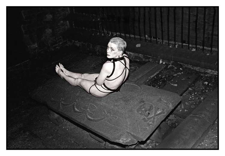 Sylvia on a Tombstone in Greyfriars, Edinburgh 1989. Photograph: Del LaGrace Volcano. EAF @ 92, Edinburgh.