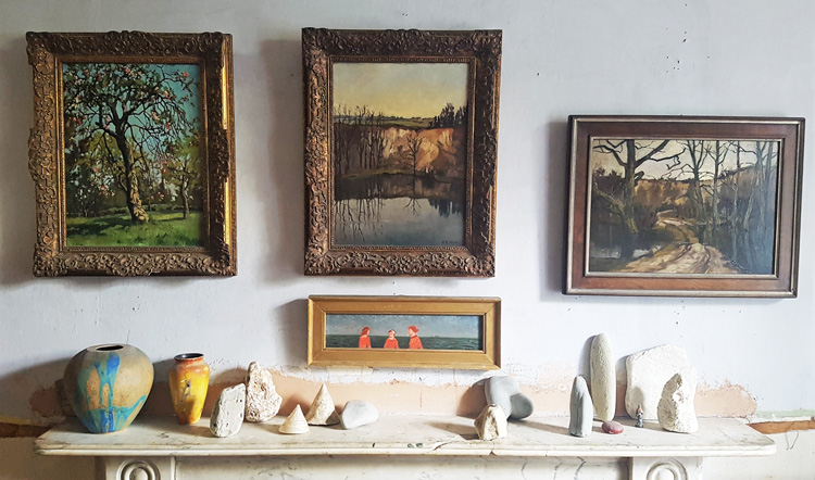 Anthony Eyton's home – mantelpiece with erratic rocks, and three of his mother's paintings, and one below by Richard Eurich. Photo: Juliet Rix.