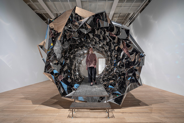 Olafur Eliasson. Your spiral view, 2002. Stainless-steel mirror, steel, 320 x 320 x 800 cm. Installation view, Tate Modern, London, 2019. Photo: Anders Sune Berg. Boros Collection, Berlin. © 2002 Olafur Eliasson.