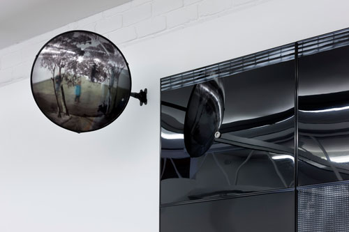 Janenne Eaton. Installation view (detail). Plexiglass, steel, photographic laminate, 45 (diam) x 41 cm.