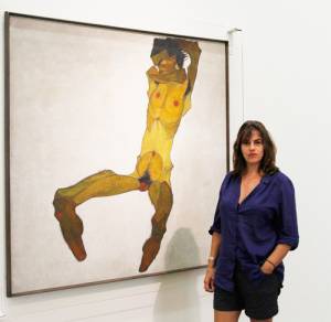 Tracey Emin at the Leopold Museum in front of Egon Schieles painting Seated Male Nude. Photograph: Leopold Museum, Wien/A. Ludwig.