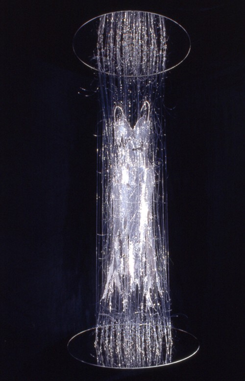 E.V. Day. Transporter, 2000. Silver sequin dress with monofilament, turnbuckles and mirrored disks. 115 x 48 x 48 in. Collection of Heather and Tony Podesta, Falls Church, VA. Courtesy of the artist.