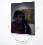Saba Farhoudnia. On February 22, 2022. Etching and acrylic on black plexiglass, metal chain, 12 x 12 in. Photo: Farzan Ghasemi.