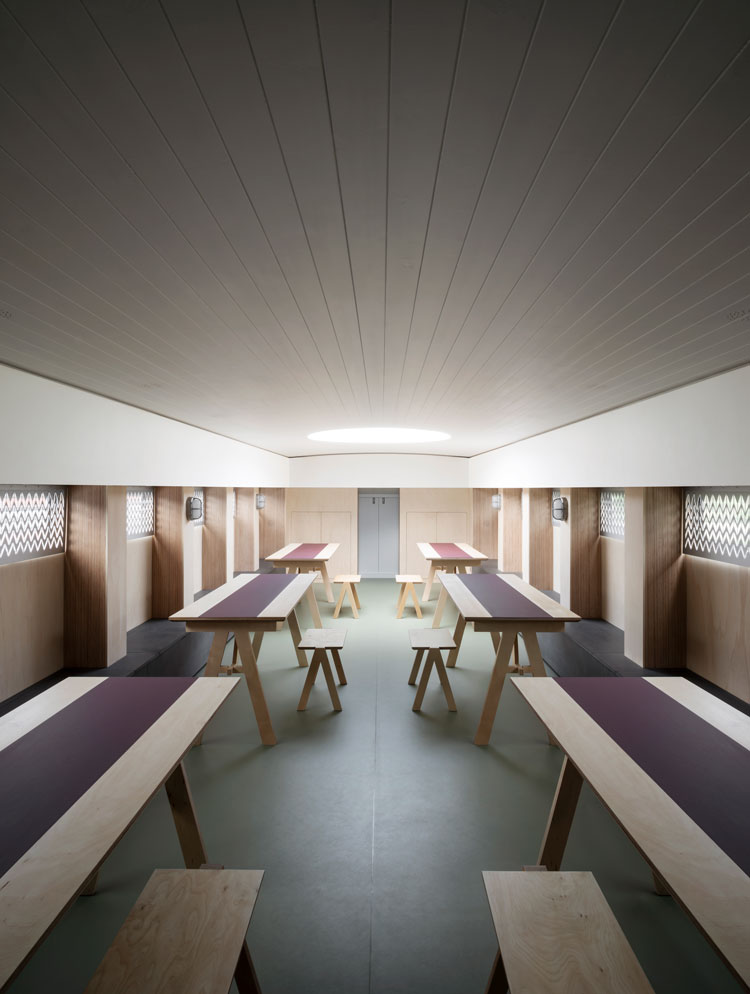 Interior with demountable stools and trestle tables. Genesis, a floating faith space, designed by architects Denizen Works. Photo: Gilbert McCarragher.