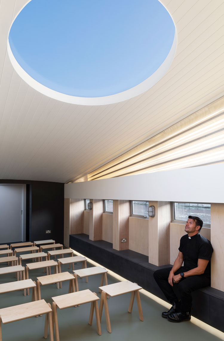 Interior view with the Reverend Dave Pilkington. Genesis, a floating faith space, designed by architects Denizen Works. Photo: Gilbert McCarragher.