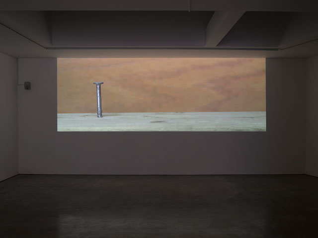 Ceal Floyer. Hammer and Nail, 2018. Video projection with audio, 
dimensions variable. © Ceal Floyer. Courtesy Lisson Gallery.