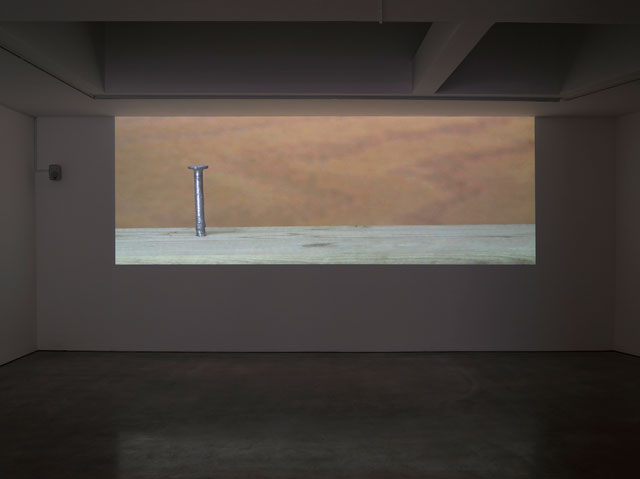 Ceal Floyer. Hammer and Nail, 2018. Video projection with audio, 
dimensions variable. © Ceal Floyer. Courtesy Lisson Gallery.