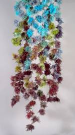 Yuh Okano. <em>Flower: Coming Events Cast Their Shadow Before</em>, 2010. Silk, partially felted with raw wool; hand-formed corsages. 71 × 20 in. (180 × 50 cm). Courtesy of the artist.