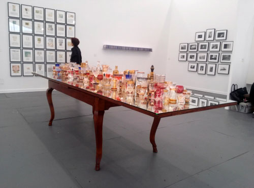 Valeska Soares. Finale, 2013. Antique table, antique glasses, wavy mirror and liquor, 78.7 x 335.3 x 92.1 cm. Galeria Fortes Vilaça, Sao Paulo.