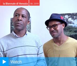 David Lewis and Billy Gerard Frank speaking to Studio International at the opening of Epic Memory, Grenada Pavilion, Venice Biennale 2019. Photo: Martin Kennedy.