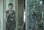 Gosia Wlodarczak. <em>Frost Drawing For Kallang, </em>2011, image 2. Performative drawing on glass 
(<em>in situ</em>), at the Old Kallang Airport, Singapore.