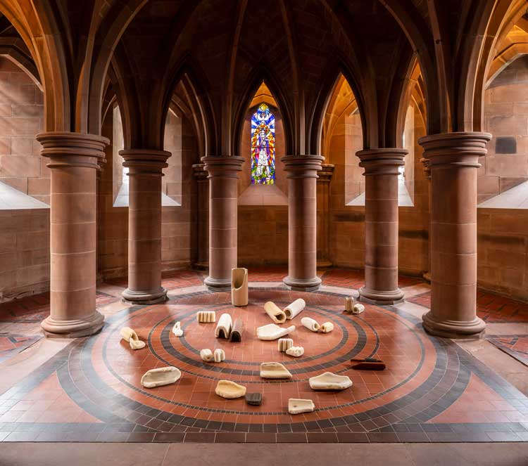 Ilana Halperin, The Rock Cycle, 2021/2026. Terracotta bricks and drainage tiles encrusted in a new layer of limestone over 3 months in the calcifying springs of the Fontaines Pétrifiantes de Saint-Nectair. courtesy the artist and Patricia Fleming Gallery.