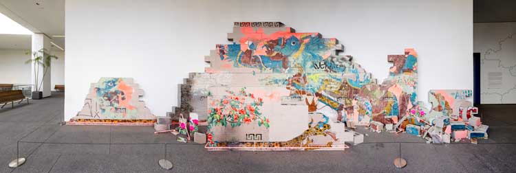 Patrick Martinez, Battle of the City on Fire, 2025. Stucco, cinder blocks, neon, acrylic paint, spray paint and latex house paint on scorched panel. Made in L.A. 2025, installation view, Hammer Museum, Los Angeles, October 5, 2025–March 1, 2026. Photo: Sarah Golonka.