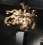 Damien Hirst, The Severed Head of Medusa. Gold and silver, 32 x 39.7 x 39.7 cm. Photograph: Joe Lloyd.