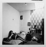 Nancy Hellebrand. <em>Marion in a Bed Sitter, </em>July 1974. Silver Gelatin. © Copyright Nacy Hellebrand.