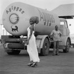 James Barnor. Model with Tank and Driver, 1974. Digital Fibre Print, 70 x 70 cm.  Copyright James Barnor. Courtesy the Artist and October Gallery, London.