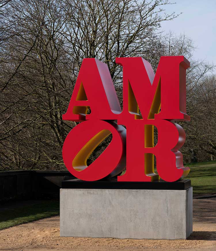Robert Indiana, AMOR (Red Yellow), 1998-2006, installation view at Yorkshire Sculpture Park, 2022. Photo: © Jonty Wilde, courtesy of Yorkshire Sculpture Park. Artwork: © 2022 Morgan Art Foundation Ltd./ Artists Rights Society (ARS), New York/DACS, London.