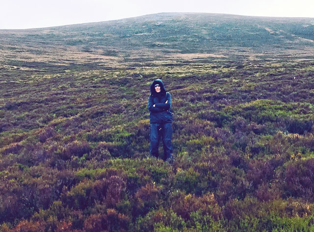 Intrepid Studio International contributor Christiana Spens hiking towards the Into the Mountains performance. Photo courtesy of the author.