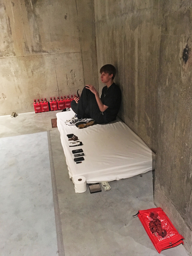 Performer on mattress, Anne Imhof: Sex at Tate Modern 2019. Photo: Veronica Simpson.