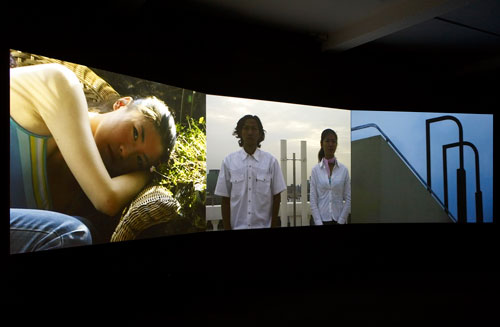 Yang Fudong. <em>Flutter, Flutter... Jasmine, Jasmine</em>, 2002. Three-channel video installation, colour, 17min 40sec. Courtesy Marian      Goodman Gallery, New York/Paris and ShanghART Gallery, Shanghai © the artist. Parasol unit installation shot. Photo Stephen White.