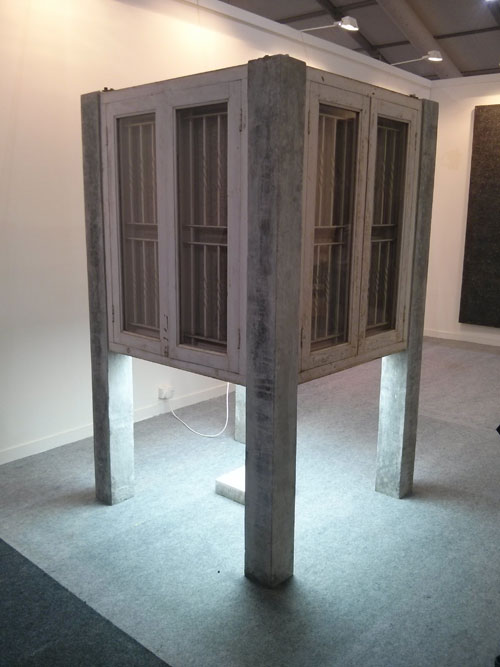 Abir Karmakar, Lighthouse, 2013. Found windows, concrete, iron pipes, plywood, household lights, 204.5 x 122 x 122 cm (80.5 x 48 x 48 in).