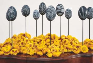 Jonathan Jones. Untitled (emu eggs) after Étienne-Pierre Ventenat, 2021–23. Emu (Dromaius novaehollandiae) eggshell, powder-coated steel, golden everlasting paperdaisy (Xerochrysum bracteatum) flowers, dimensions variable. Courtesy the artist. Photo: Jenni Carter.