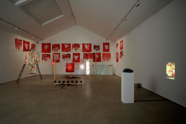 Joan Jonas. The Juniper Tree, 1976/1994. Installation - 24 works on silk, acrylic paint, wooden structure, string of 29 wooden balls, ladder, kimono, mirror, glass jars, 78 slides, box and other materials, overall display dimensions variable. Tate, purchased 2008. Wilkinson Gallery, London, 2008. Photograph courtesy Wilkinson Gallery, London. Photograph: Peter White. © 2018 Joan Jonas : Artists Rights Society (ARS), New York : DACS, London.