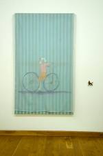 Jenny Watson. <em>Bicycle girl</em> 2007. Acrylic on rabbit skin glue primed cotton, stretched, with flecked voile overlay + s
mall plastic horse, 152 cm x 89 cm.  Courtesy Transit Gallery, Mechelen, Belgium.